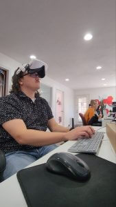 man wearing a vr headset at work 