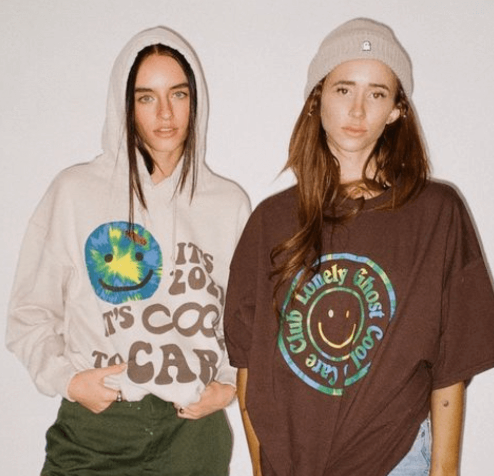 2 early 20's aged models wearing the Lonely Ghost Merch from 2023